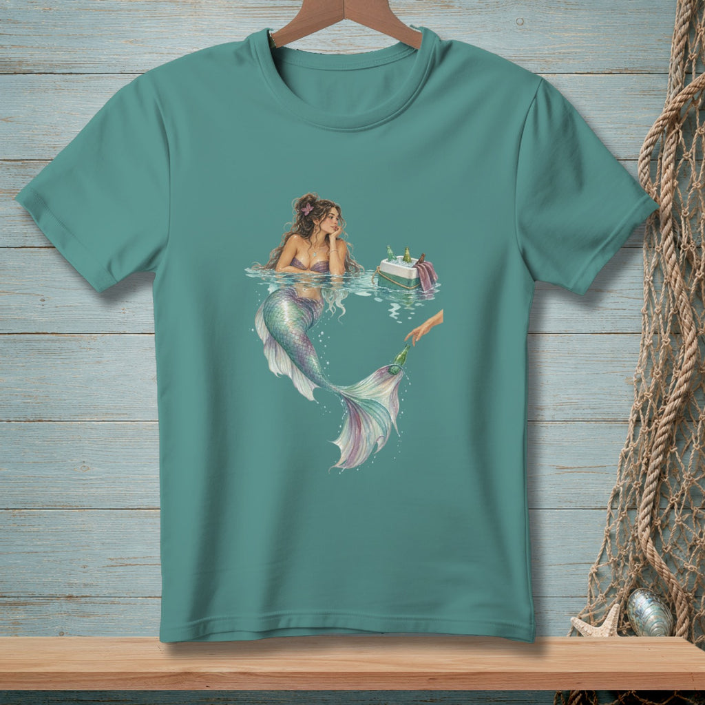 Mermaid in water reaching for a bottle from a cooler next to a raft.