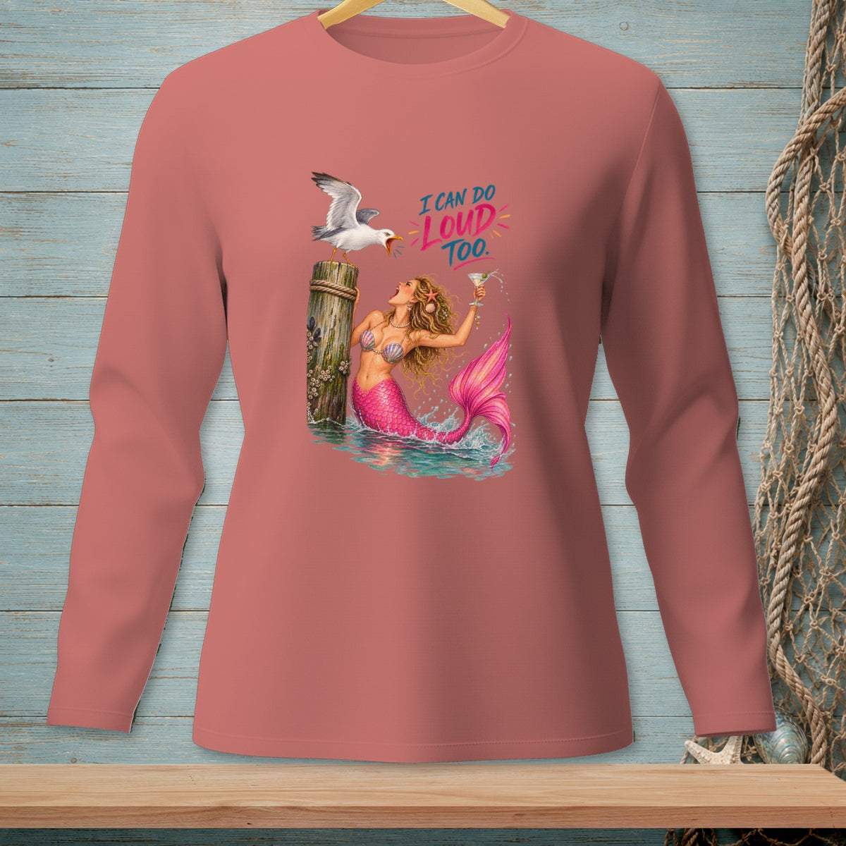 Mermaid with pink tail holds a martini, seagull on post. "I CAN DO LOUD TOO."