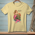 Light yellow t-shirt with mermaid and lobster graphic saying "That's nice. What else?".