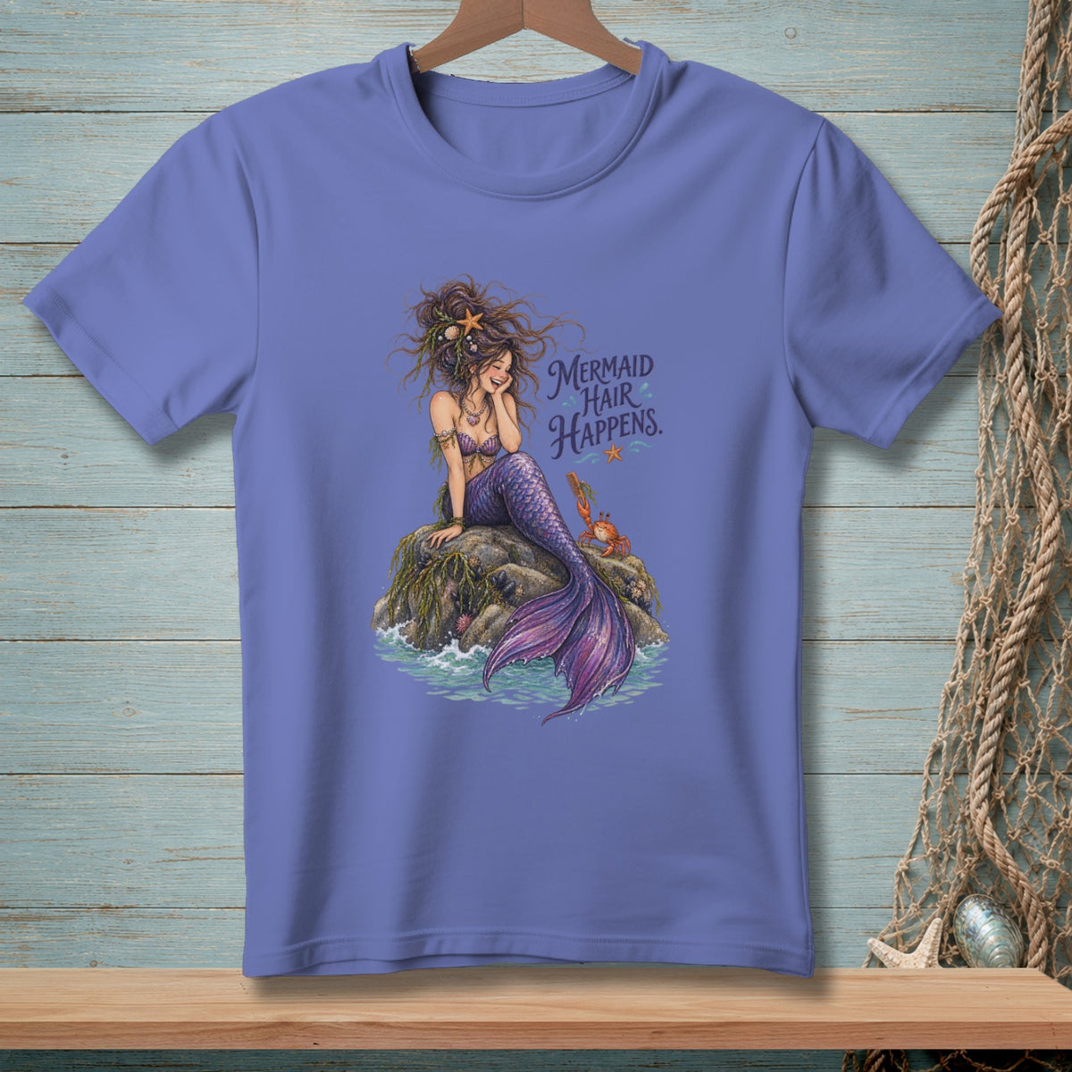 Purple t-shirt with mermaid illustration and text "Mermaid Hair Happens."