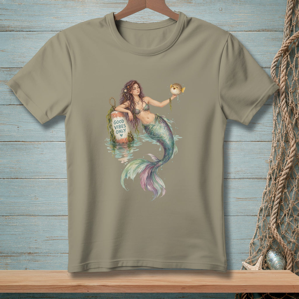 Mermaid holding pufferfish next to buoy that reads "Good Vibes Only".