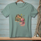 Mint green t-shirt with sleeping mermaid and colorful fish illustration.
