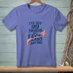 Purple t-shirt with text "I've got 99 problems but legs ain't one" and a mermaid tail.