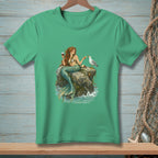 Green t-shirt with a mermaid sitting on rocks, drinking wine and feeding a seagull.