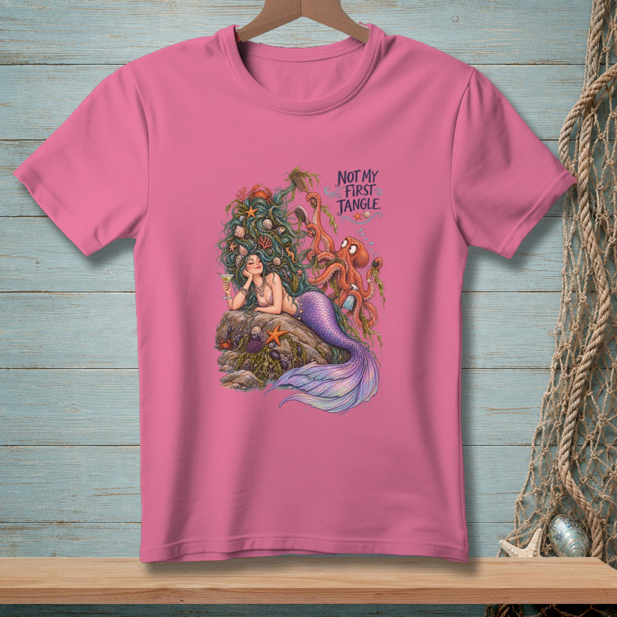 Pink t-shirt with a mermaid and octopus graphic, reads "Not My First Jangle."