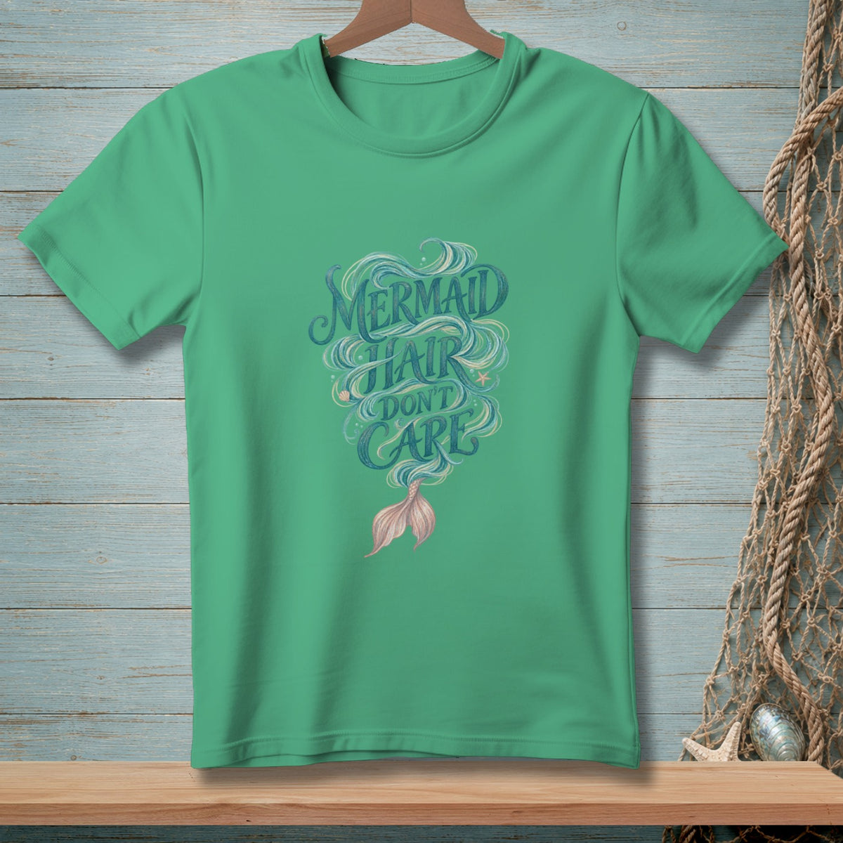 Green t-shirt with "Mermaid Hair Don't Care" text and a mermaid tail graphic.