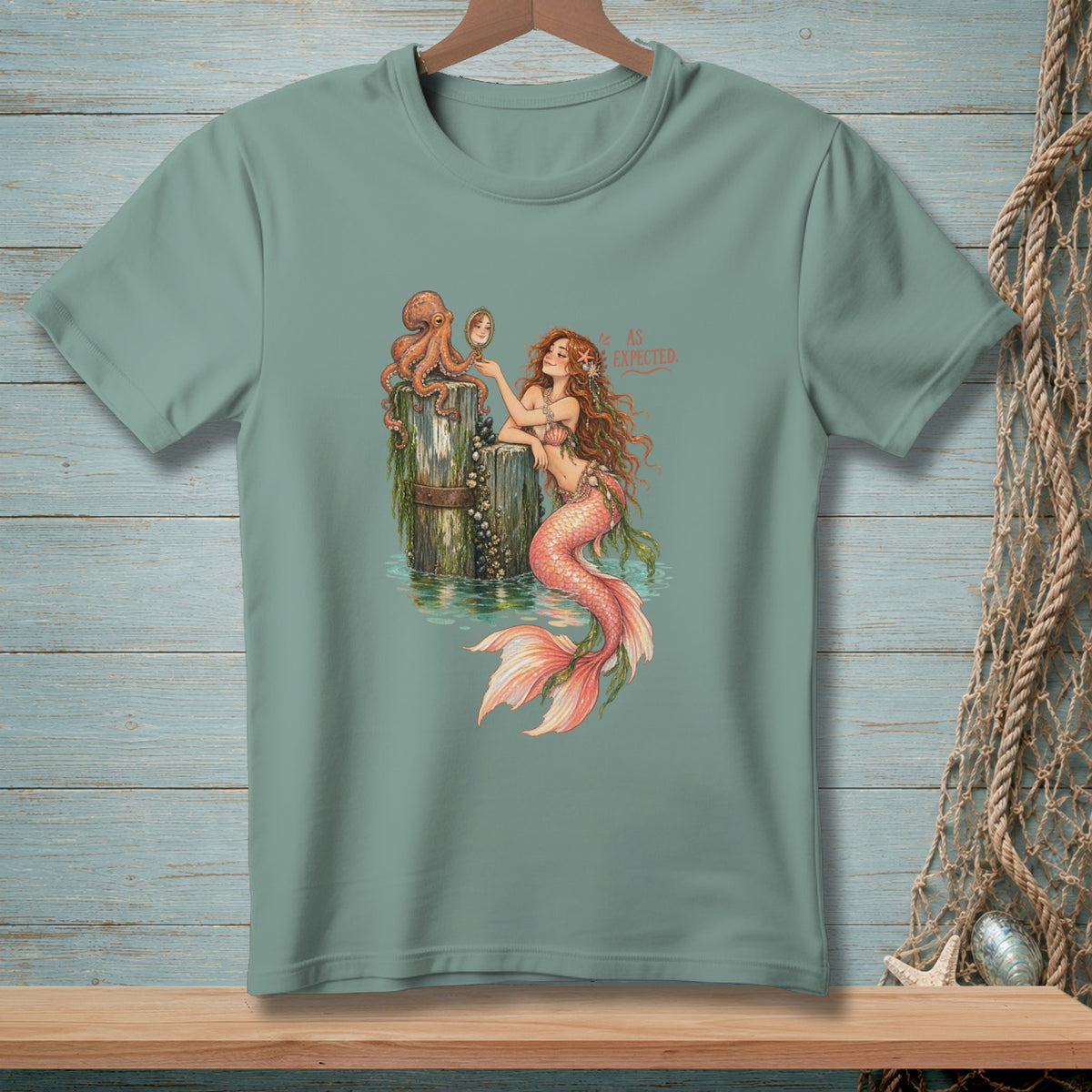 Mermaid with octopus on a post, looking in a mirror, with text "AS EXPECTED."