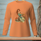 Mermaid with crab and picnic basket sitting on a rock.