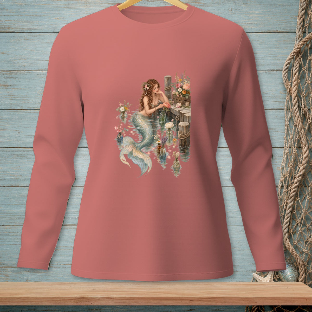 Mermaid with flowers on a wooden dock surrounded by bottles and water.