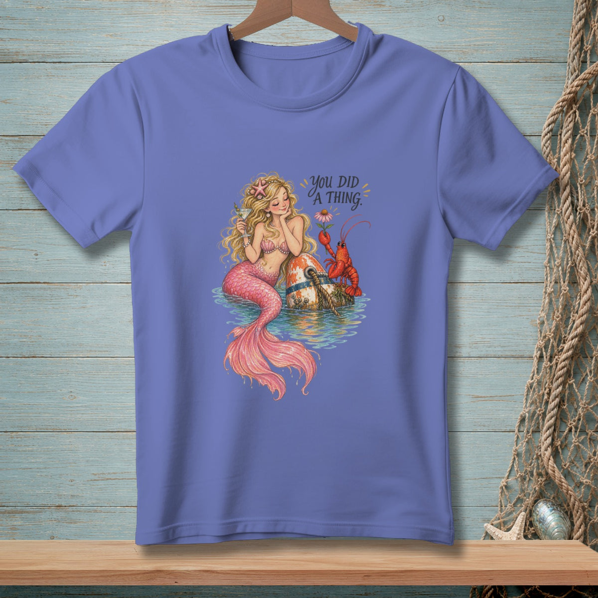 Illustration of a mermaid with a lobster and text that reads "YOU DID A THING."