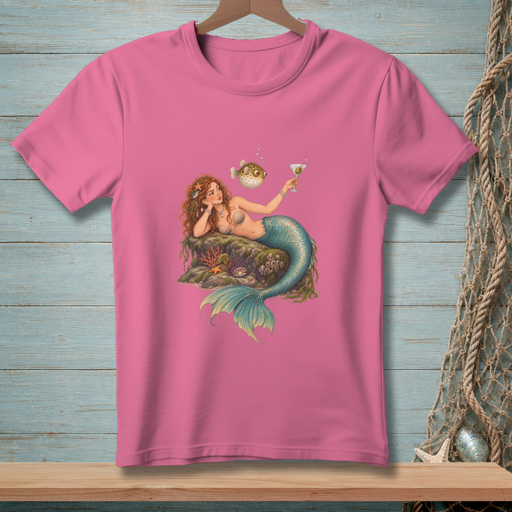 Pink t-shirt with illustration of a mermaid holding a drink next to a pufferfish.