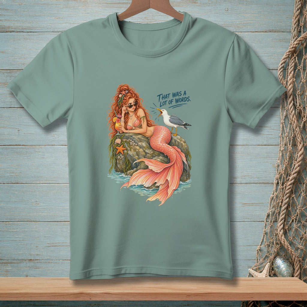 Mermaid with coral tail, sunglasses, and drink, next to seagull with text "That was a lot of words."