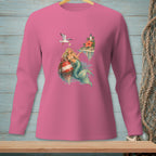 Pink long-sleeve shirt with a mermaid, buoy, seagull, and island graphic.