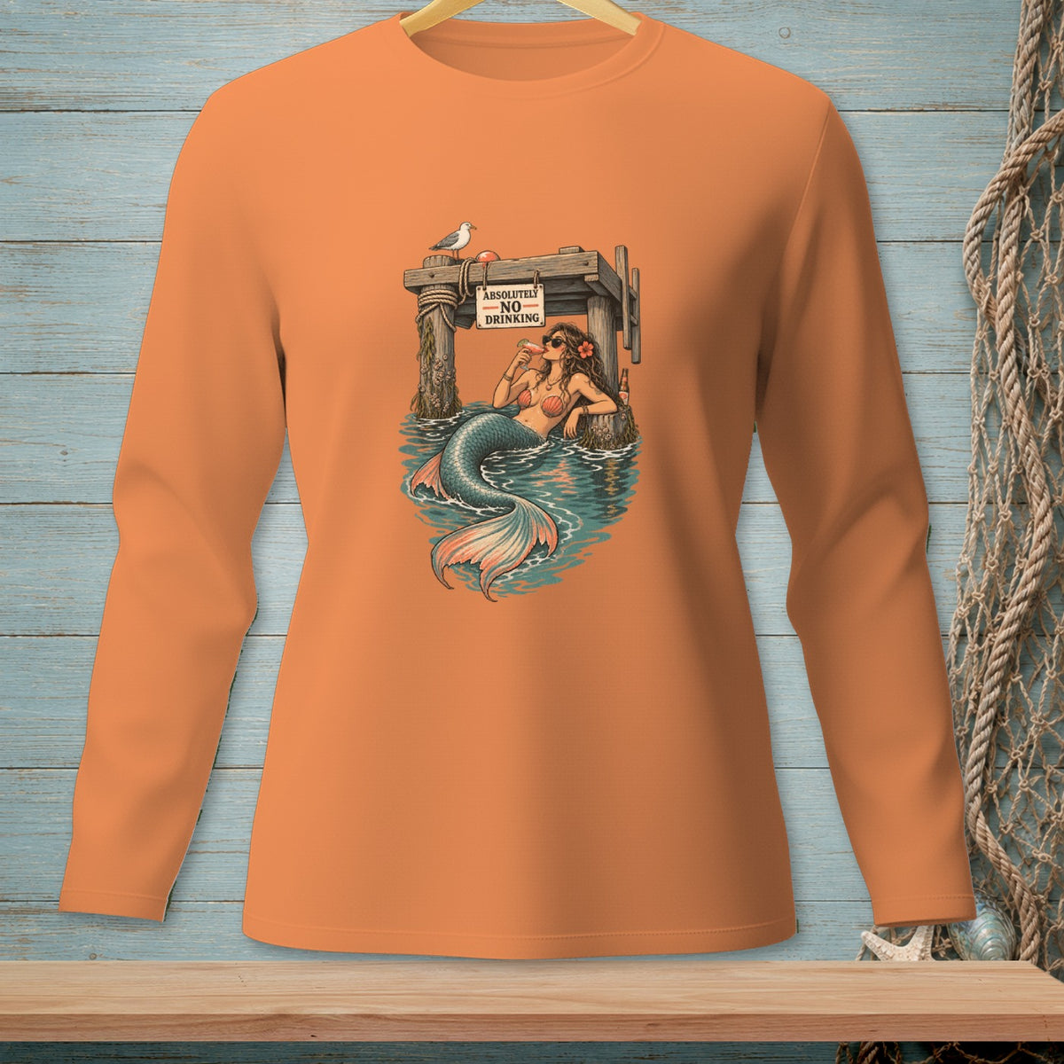 Mermaid by dock with sign "ABSOLUTELY NO DRINKING" holding a drink.