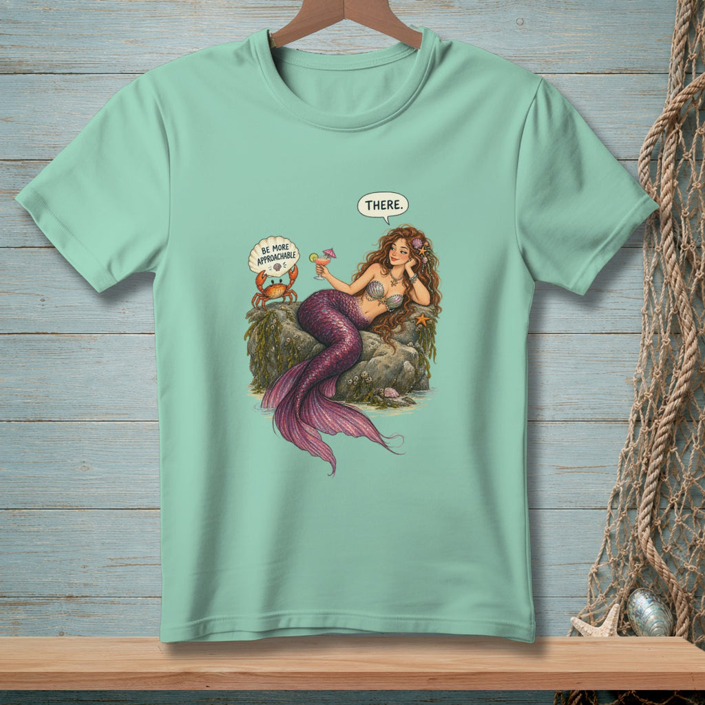 Mermaid with cocktail and crab on rock, saying "THERE."