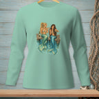 Two mermaids with colorful tails sit on a dock, drinking wine.