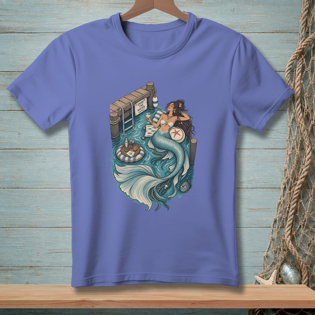 Mermaid relaxing by a dock with "Share the Water" sign and a drink.