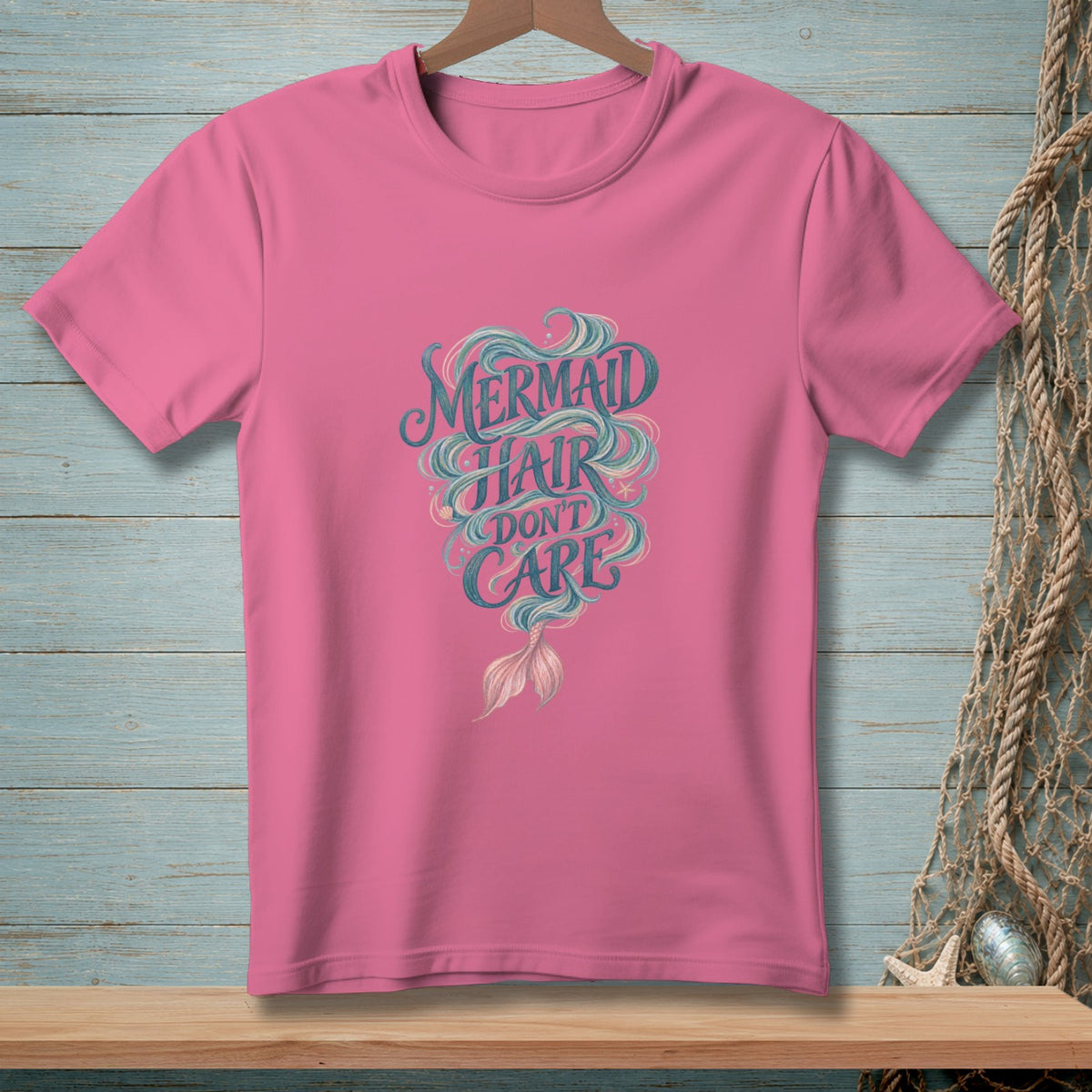Pink t-shirt with "Mermaid Hair Don't Care" graphic and a mermaid tail.