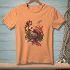 Orange t-shirt with mermaid and lobster graphic that says "AND?"