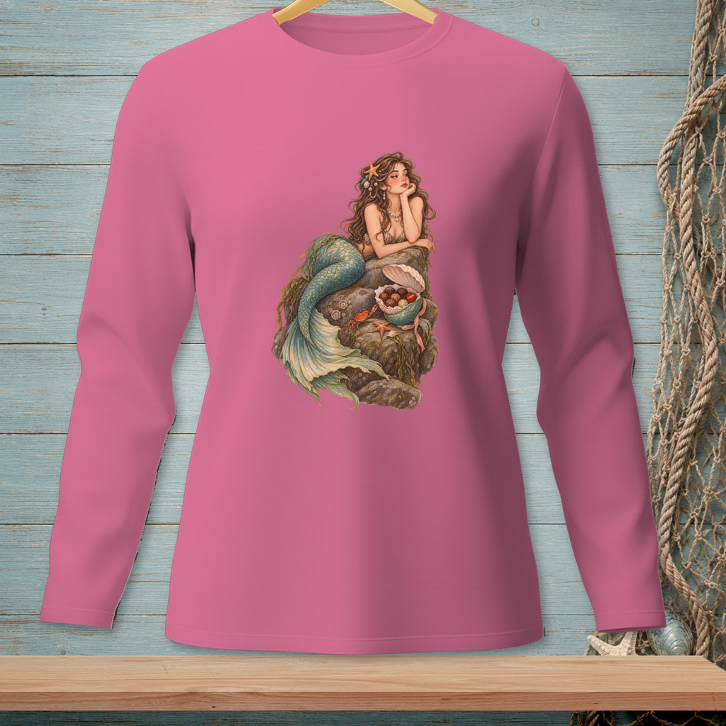 Pink long-sleeve shirt with a mermaid illustration on a rock.