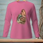 Pink long-sleeve shirt with a mermaid illustration on a rock.