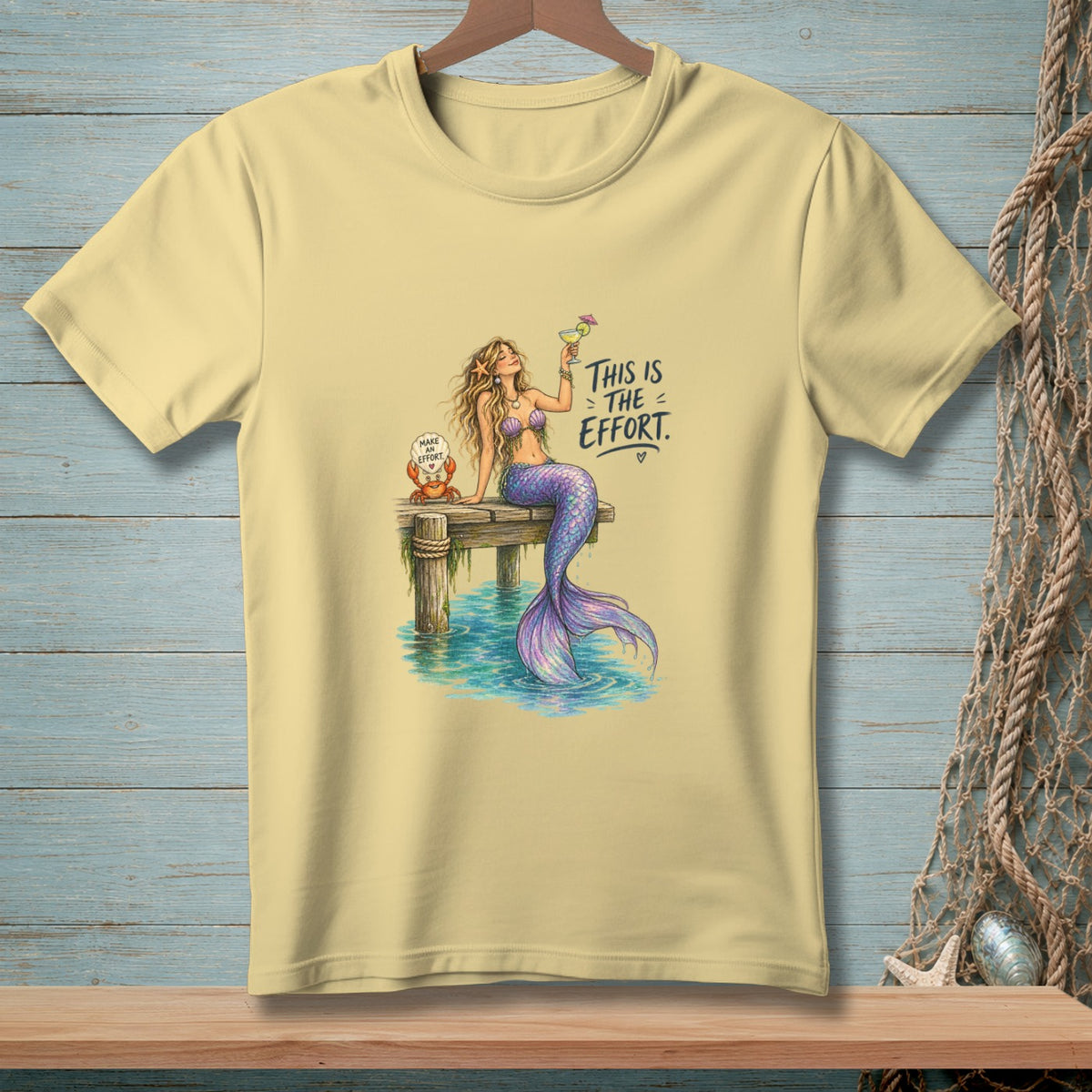 Mermaid with drink on dock, crab with text "Make effort" and "This is the effort".