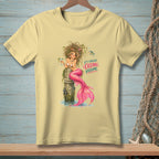 Yellow t-shirt with a cartoon mermaid sitting on a pier, holding a drink. Text reads "IT'S CALLED OCEAN VOLUME."