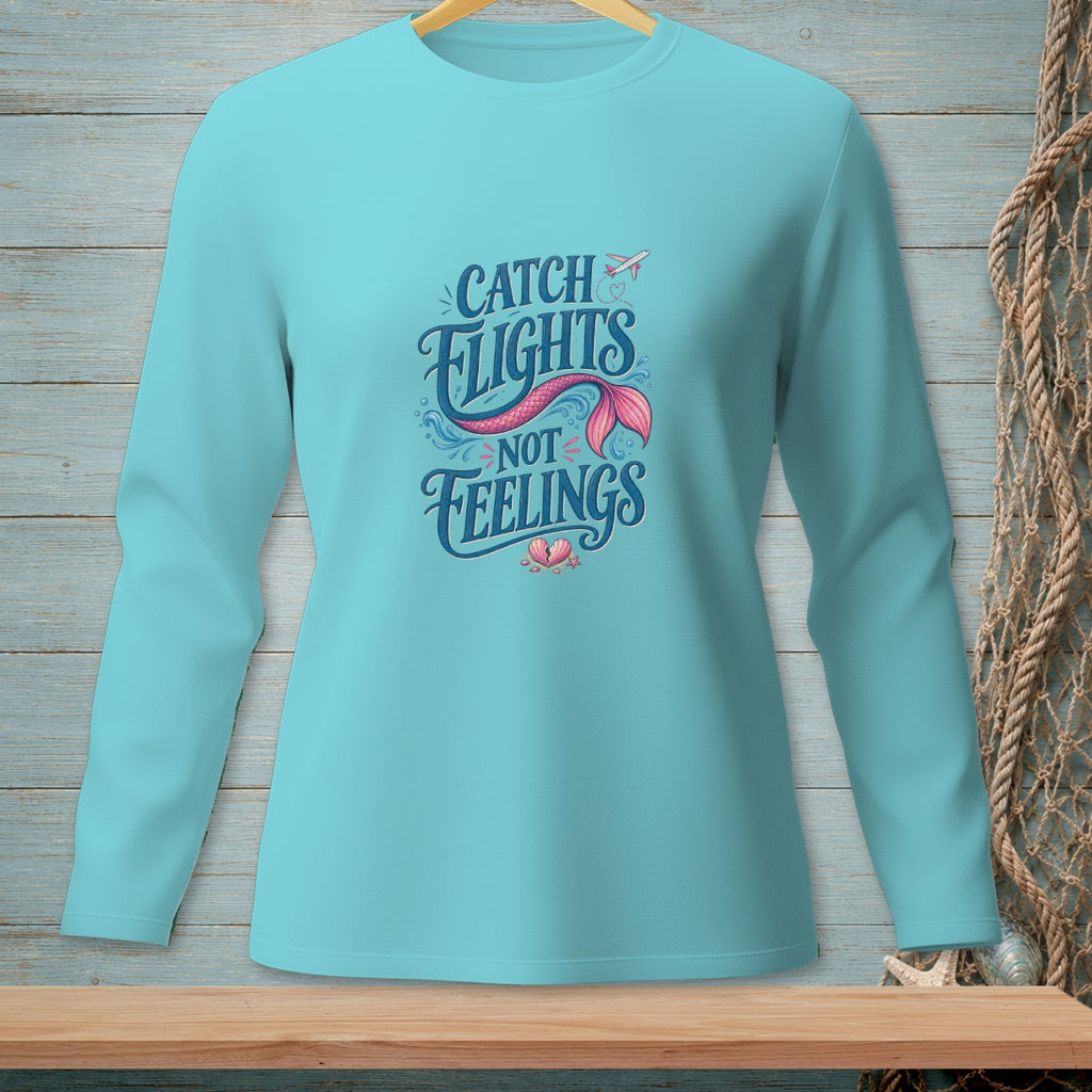 Teal long-sleeve shirt with "Catch Flights Not Feelings" mermaid tail graphic.