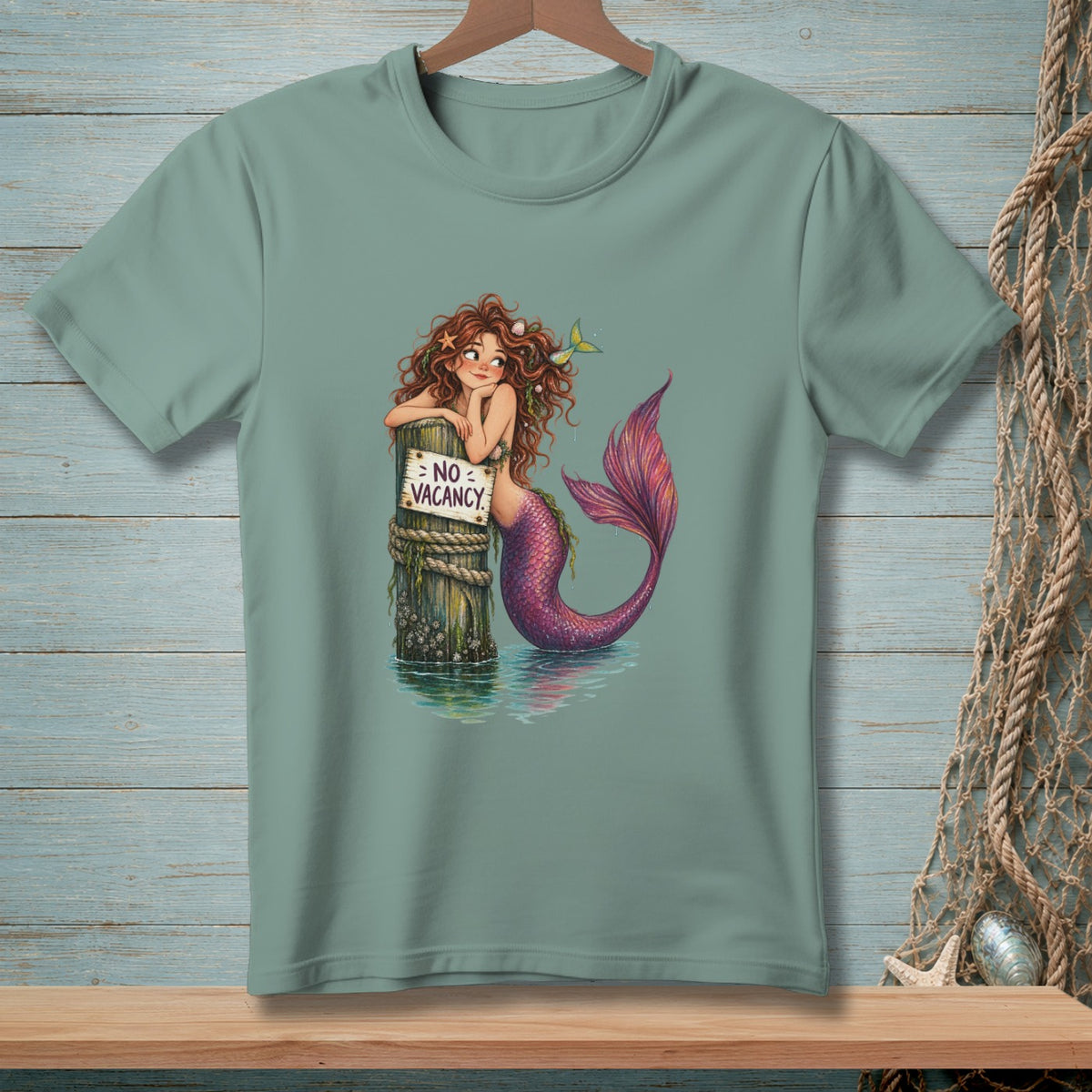 Mermaid leaning on a post with a "No Vacancy" sign, wearing a purple tail.