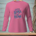 Pink long-sleeve shirt with "Catch Flights Not Feelings" mermaid tail design.