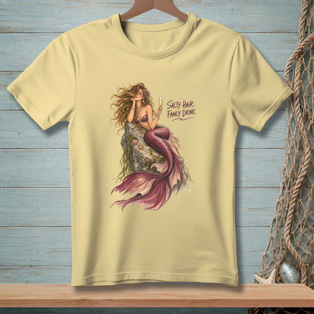 Pale yellow t-shirt with mermaid graphic and text "Salty Hair. Fancy Drink."