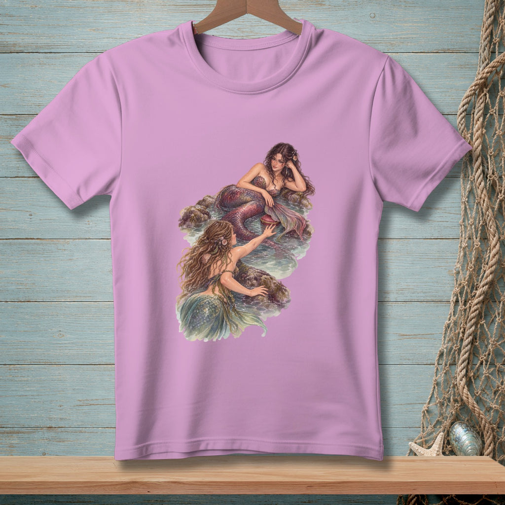 Pink t-shirt with two mermaids rendered in watercolor style artwork.
