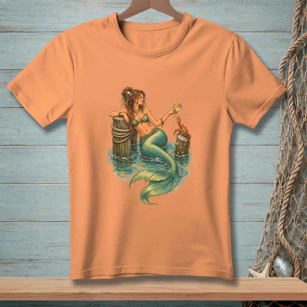 Mermaid with green tail and bikini sits on post, drinks cocktail with crab nearby.