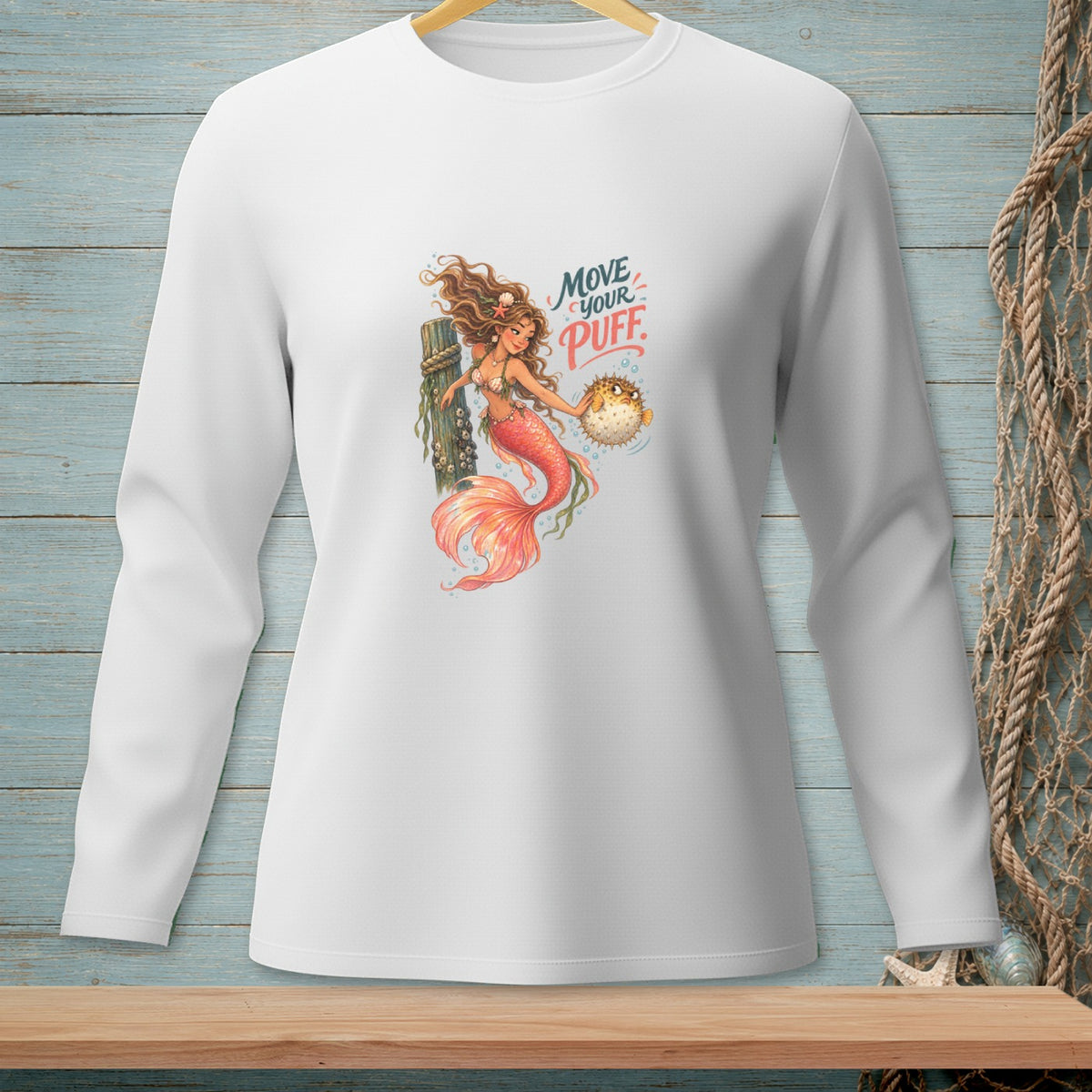 White long-sleeve shirt with graphic of mermaid holding a pufferfish and text "Move your Puff".