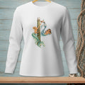 White long sleeve shirt with graphic of two mermaids reaching for a basket on a pier.