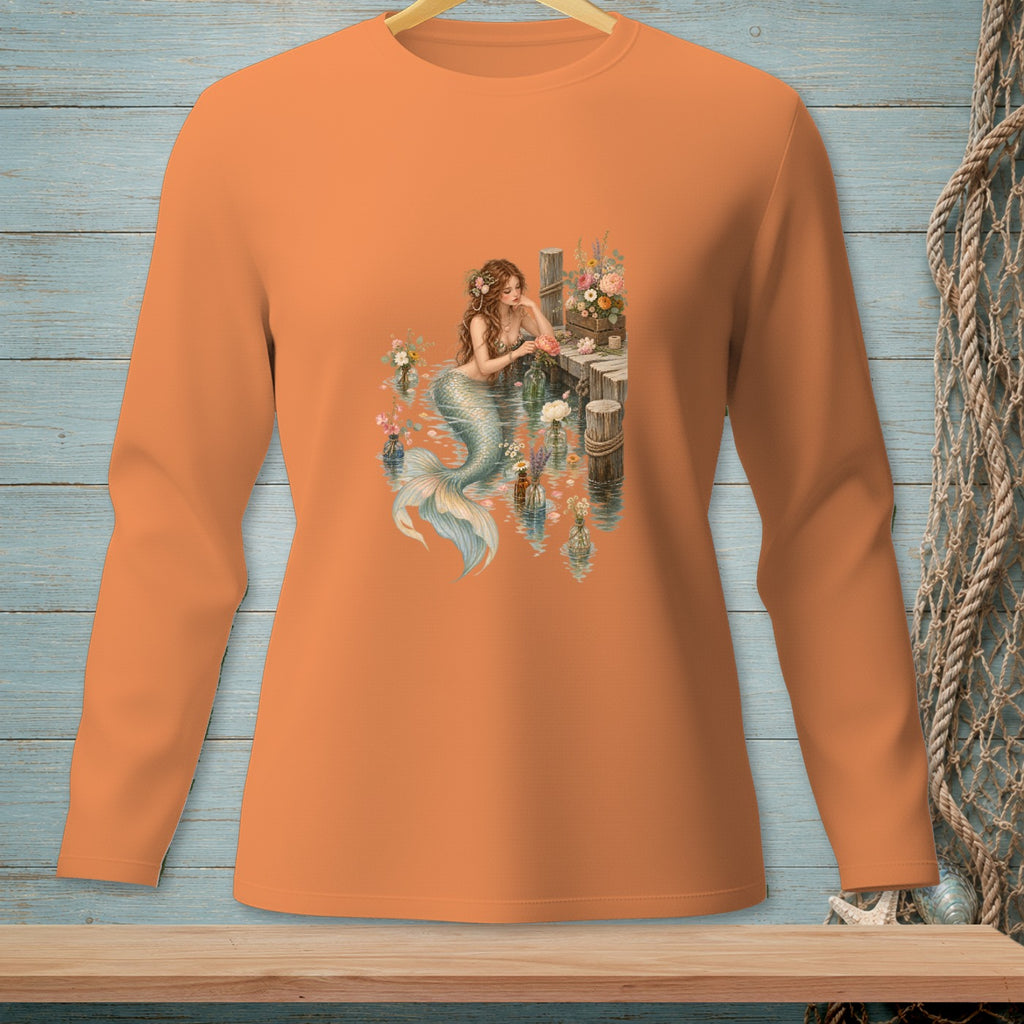 Long-sleeve orange shirt with a mermaid and floral arrangement graphic.