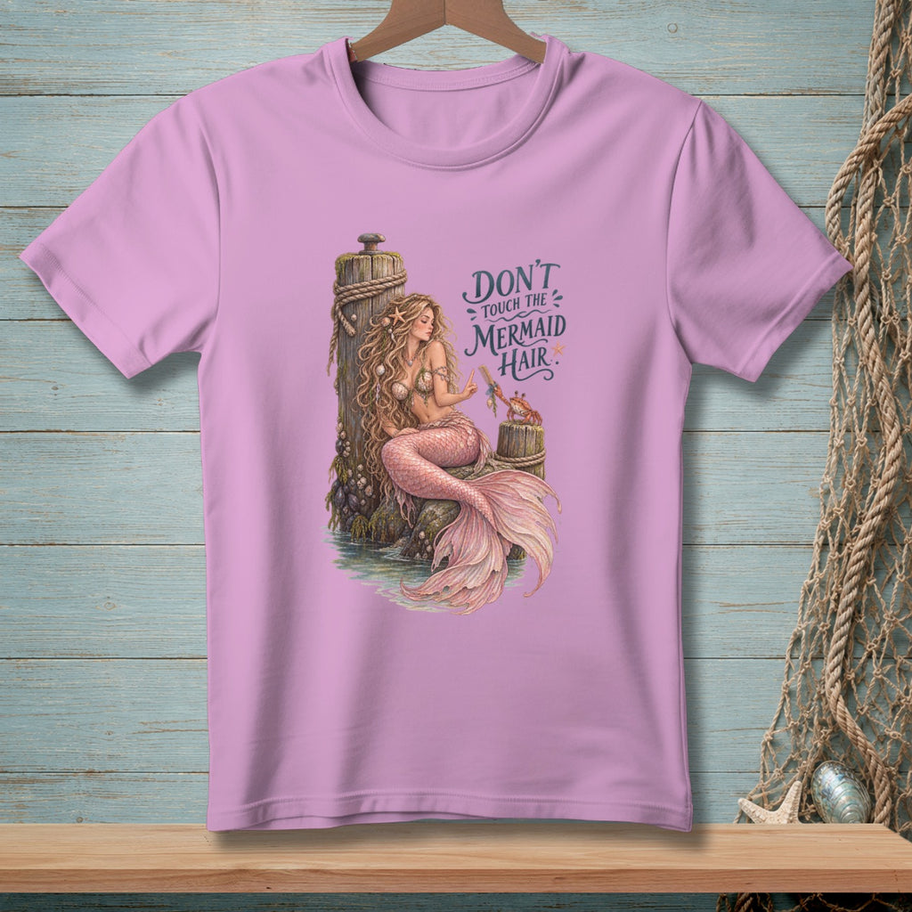 A mermaid sits on a post with the text "Don't Touch the Mermaid Hair".