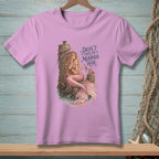A mermaid sits on a post with the text "Don't Touch the Mermaid Hair".