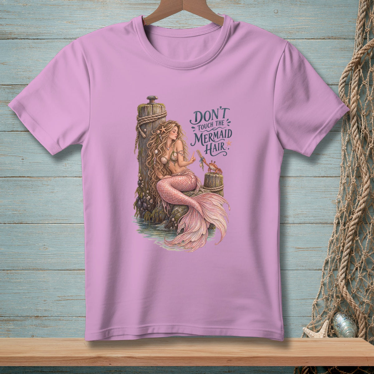 A mermaid sits on a post with the text "Don't Touch the Mermaid Hair".