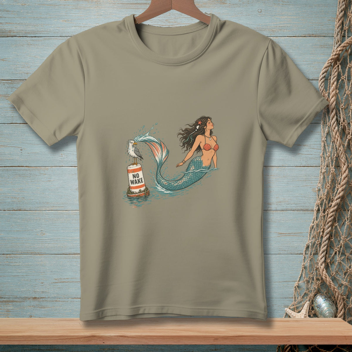 Mermaid with a seagull on a "NO WAKE" buoy in the water.