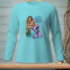 Mermaid with purple tail on a dock drinking from a coconut, with "Salty, Tangled & Unbothered" text.
