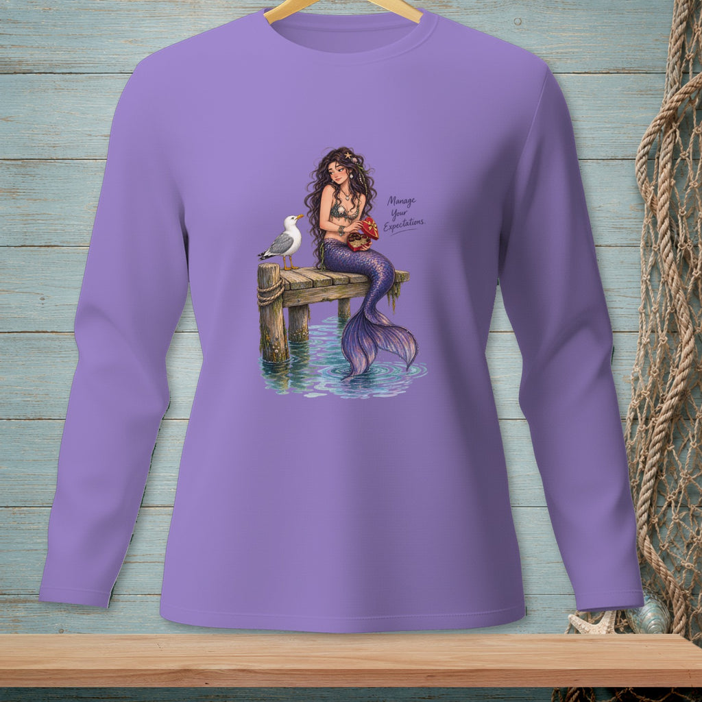 Mermaid with seagull on pier, holding a treasure chest, text "Manage Your Expectations."