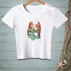 White t-shirt featuring a mermaid and a lobster on a dock.