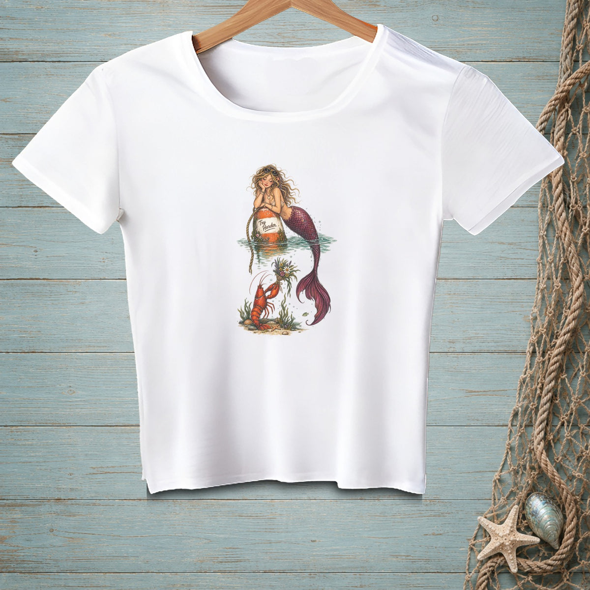 T-shirt with a mermaid and lobster graphic, featuring text "Try Harder".