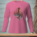 Pink long-sleeve shirt with a graphic of a mermaid and octopus on a dock.