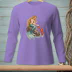 Mermaid sitting on rock with lobster and pearl on purple long-sleeve shirt.