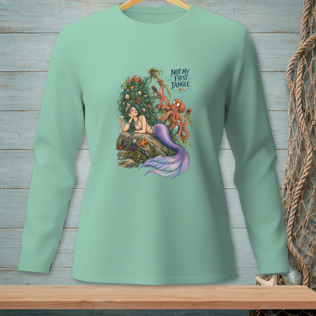 Mermaid with octopus and text "NOT MY FIRST JANGLE" on a light green long-sleeve shirt.