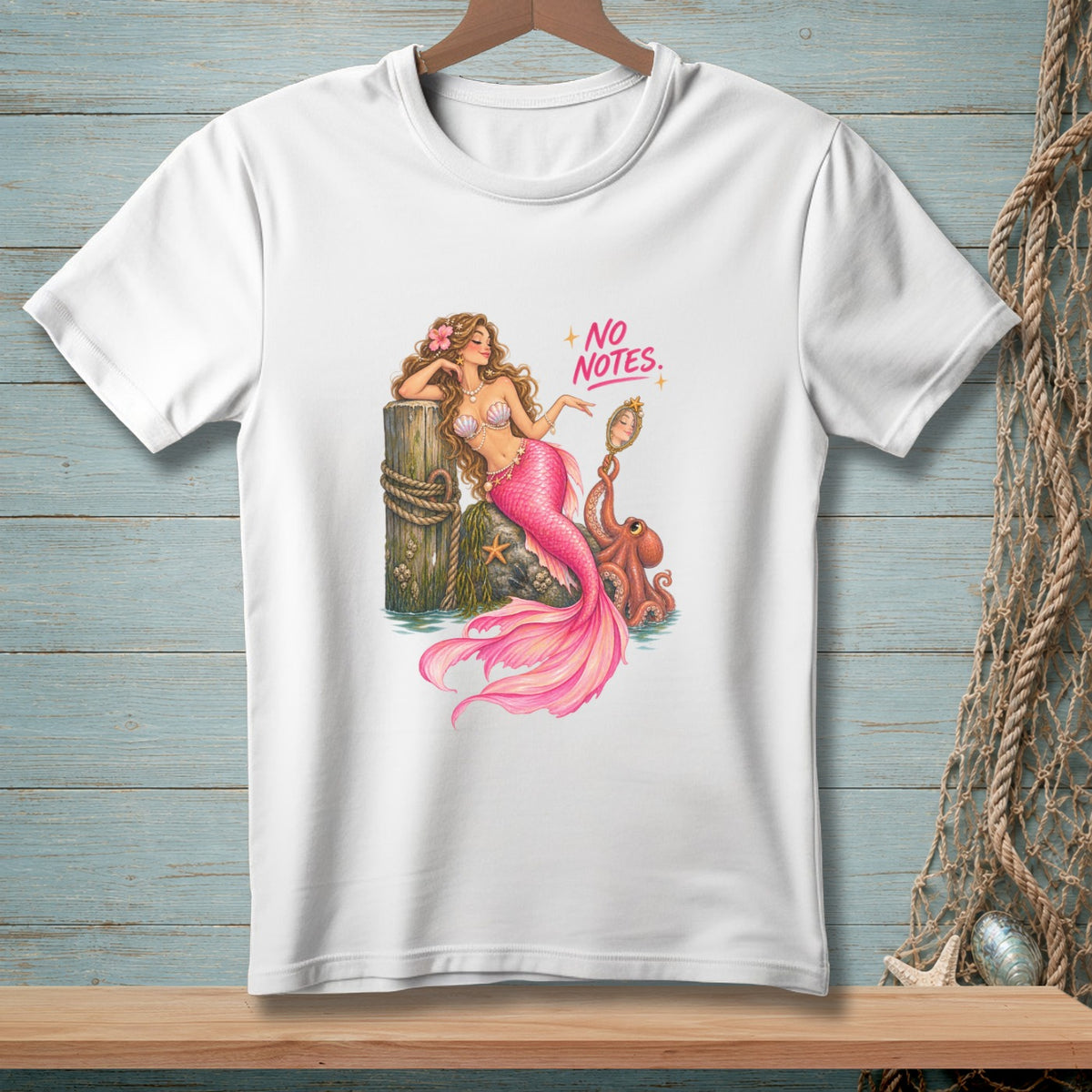 White t-shirt with a mermaid, octopus, and text reading "NO NOTES".