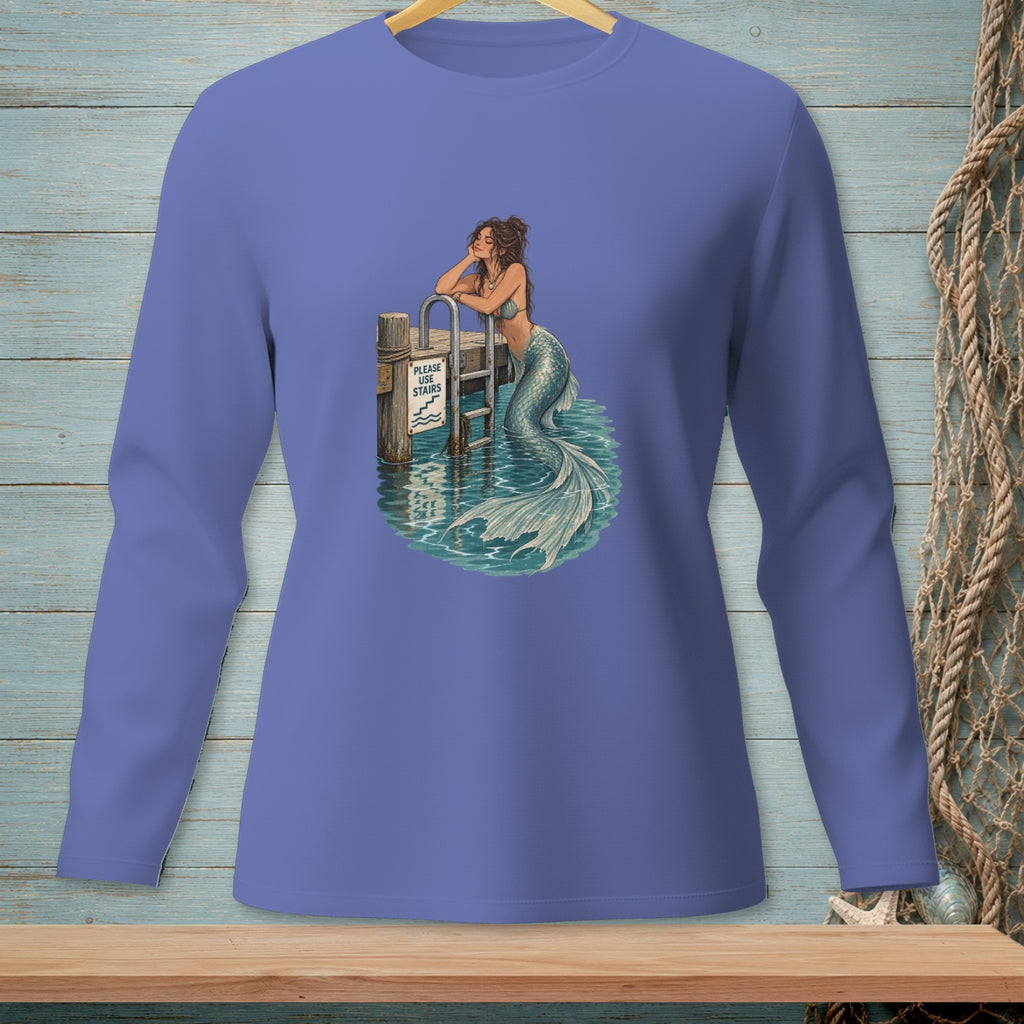 Mermaid leans on dock railing with "Please Use Stairs" sign above water.
