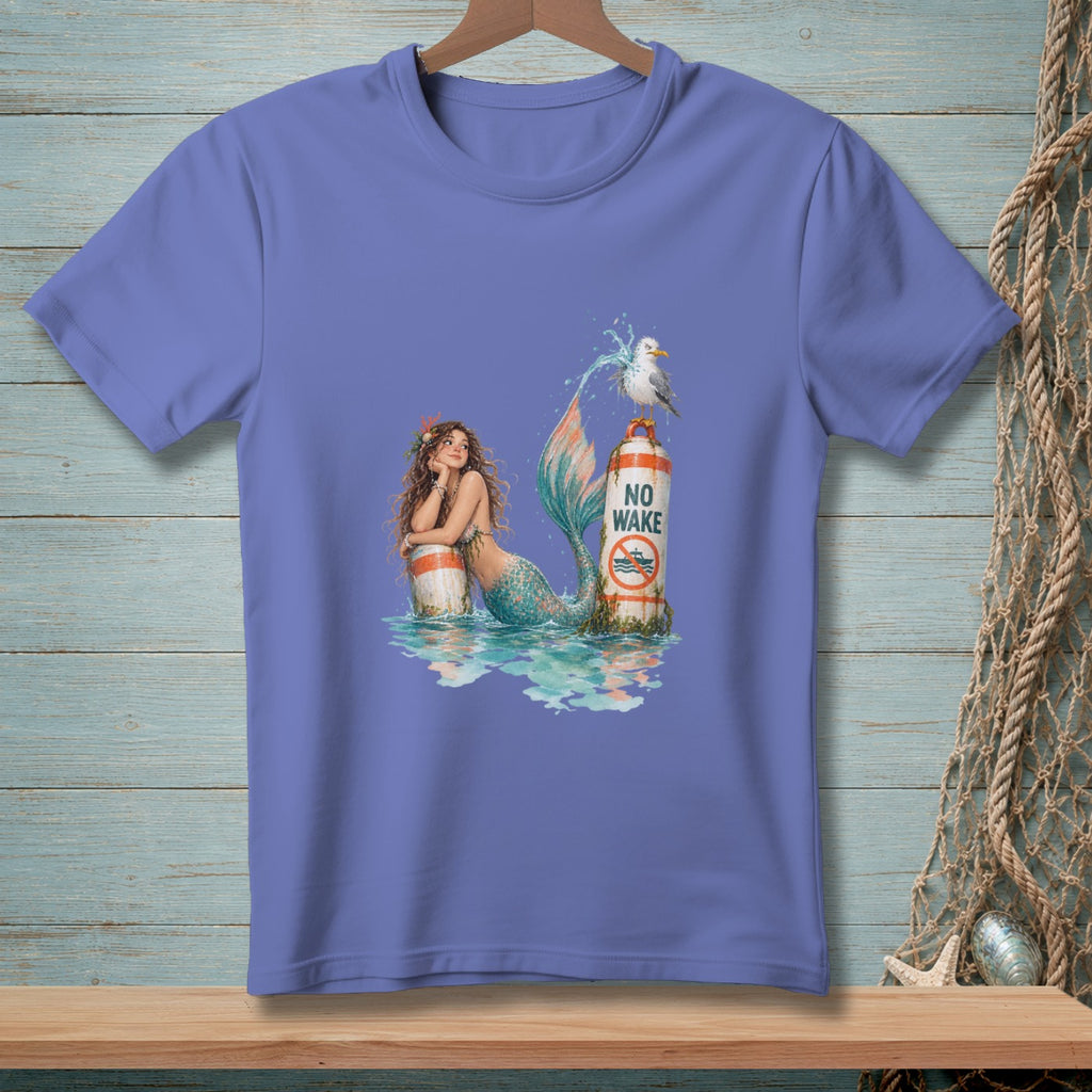 Mermaid leans on buoy with "No Wake" sign and seagull.